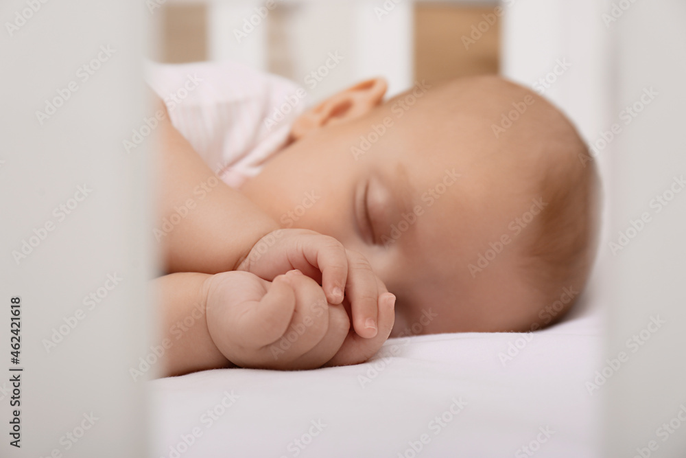 Cute little baby sleeping in crib, closeup Cute little baby sleeping in crib, closeup