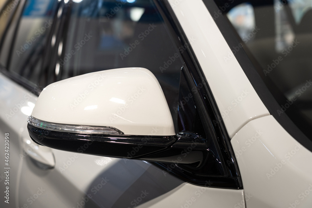 Side mirror with LED turing signal light on the luxury sport car. Vehicle equipment part object photo. Side mirror with LED turing signal light on the luxury sport car. Vehicle equipment part object photo.