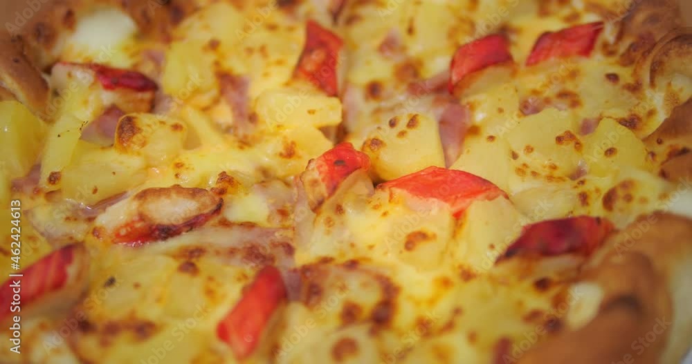 Close up rotate shot of delicious ham, crab sticks pizza and cheese. Close up rotate shot of delicious ham, crab sticks pizza and cheese.