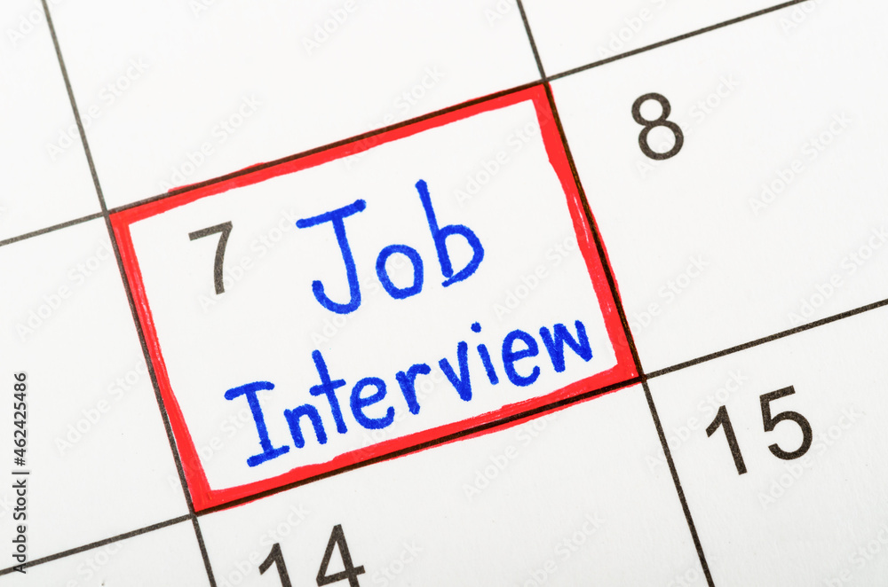 The words Job Interview written in calendar. The words Job Interview written in calendar.