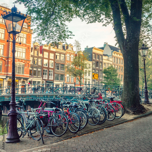 Popular bicycles in Europe. Many bicycles are parked on the street and traditional old European houses. Amsterdam, Netherlands, Holland