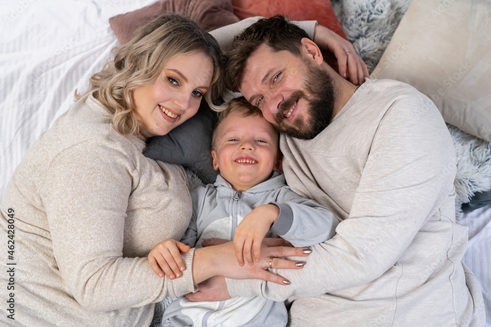 Happy family concept Mother father and son have fun at home Happy family concept Mother father and son have fun at home