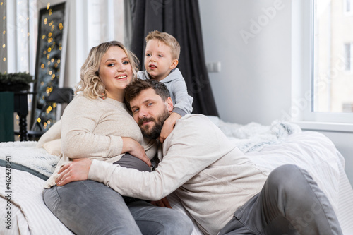 Happy family concept Mother father and son have fun at home