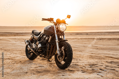 Photo of retro motorcycle on summer day outdoors photo