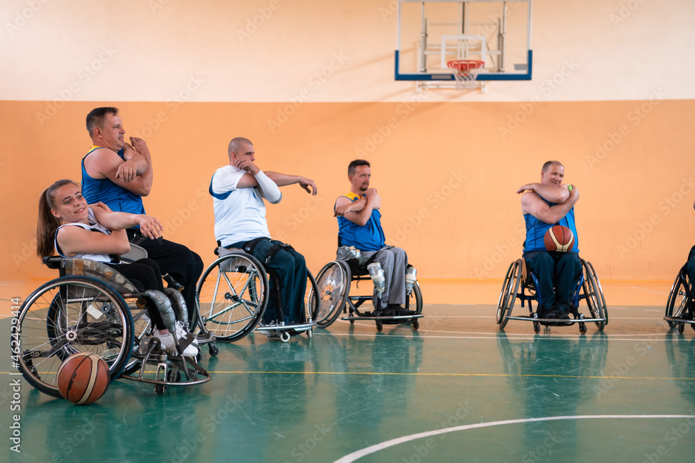 teams of basketball teams with disabilities warm up and do stretching exercises before training begins
