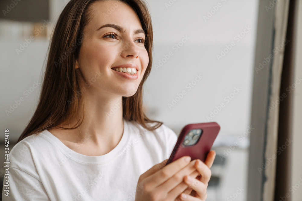 Smiling young woman in lounge wear standing Smiling young woman in lounge wear standing