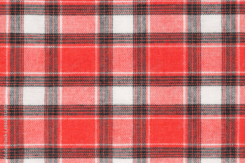 Red white tartan texture background. shirt fabric with a checkered pattern. factory material Red white tartan texture background. shirt fabric with a checkered pattern. factory material