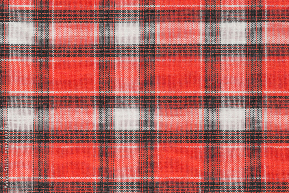 Red white tartan texture background. shirt fabric with a checkered pattern. factory material Red white tartan texture background. shirt fabric with a checkered pattern. factory material