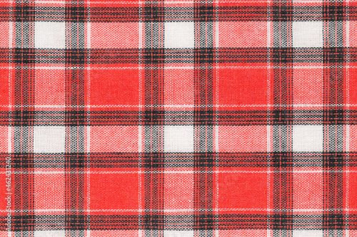 Red white tartan texture background. shirt fabric with a checkered pattern. factory material