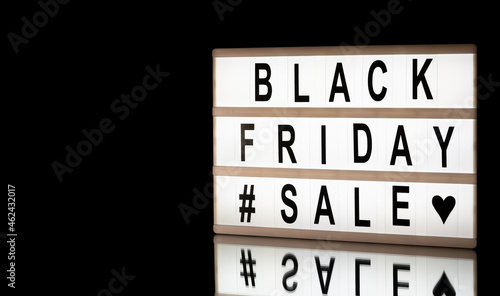 Black friday sale written on information light boxing sign on black background. With place for text.