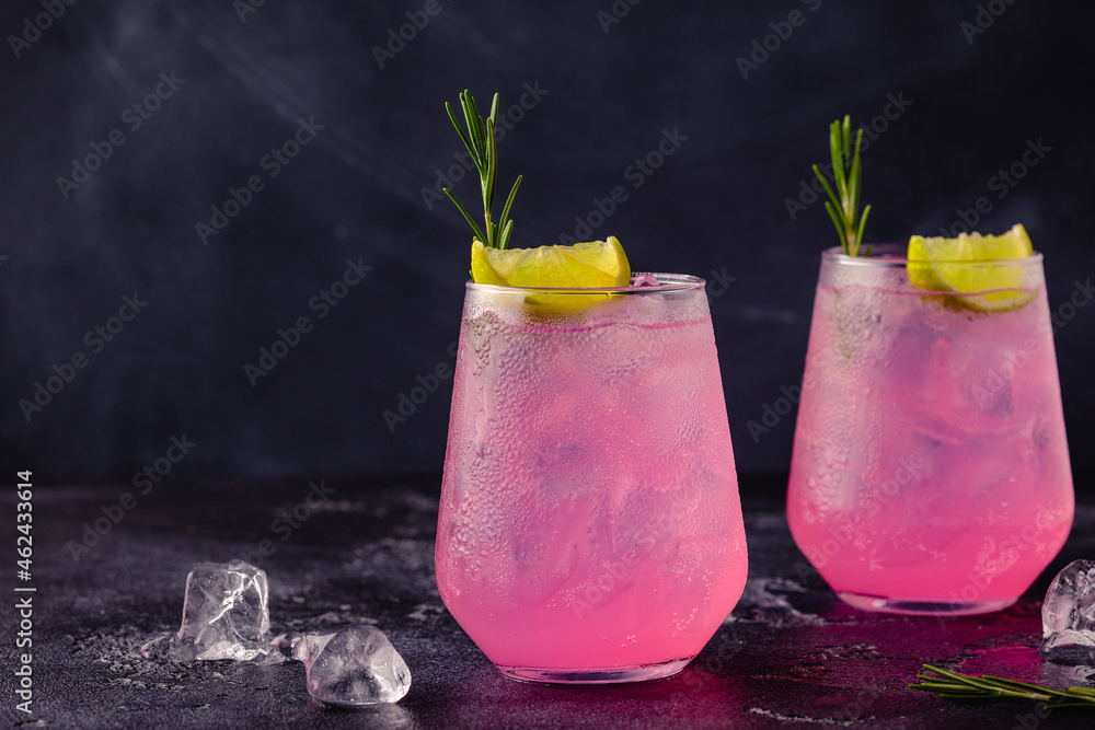 Refreshing pink drink or cocktail with ice - obrazy, fototapety, plakaty 