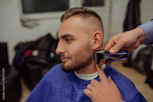 Young Man in Barbershop Hair Care Service Concept. Selective focus