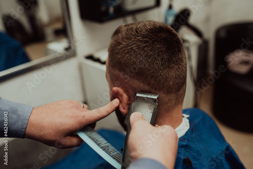 Young Man in Barbershop Hair Care Service Concept. Selective focus