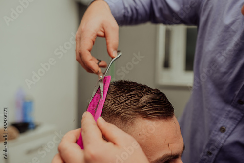 Young Man in Barbershop Hair Care Service Concept. Selective focus