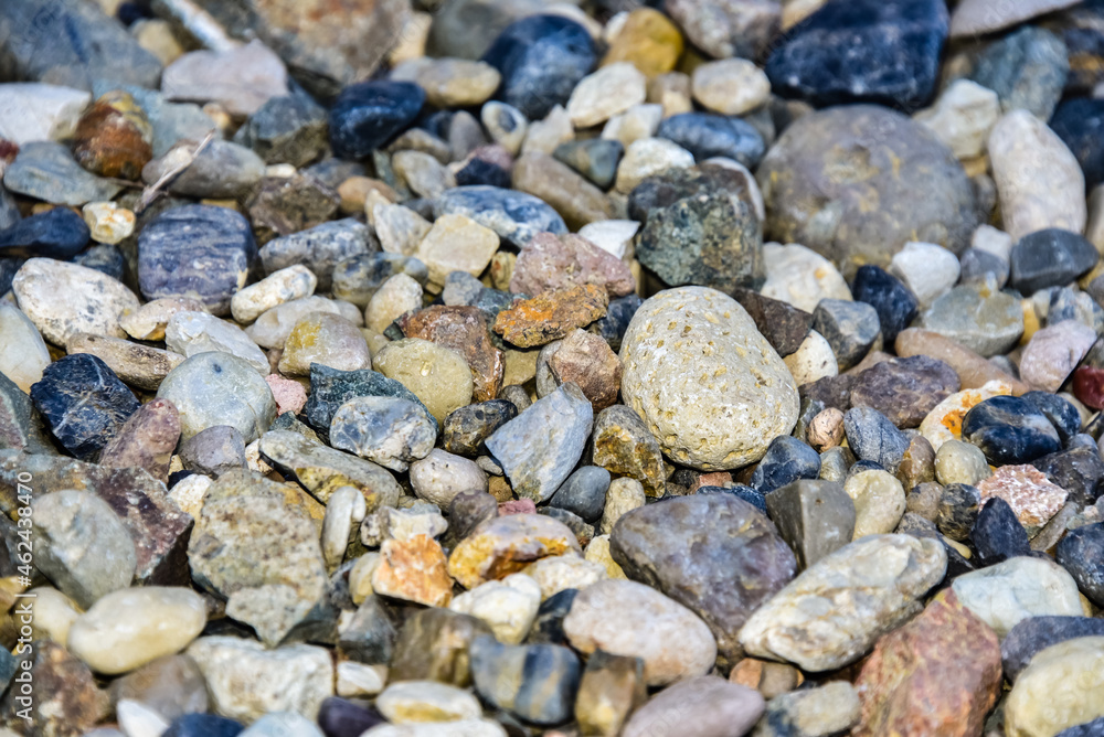 Rocks sea beach or stones background, Many small stones in assorted colors, Abstract rough wallpaper nature concept Rocks sea beach or stones background, Many small stones in assorted colors, Abstract rough wallpaper nature concept