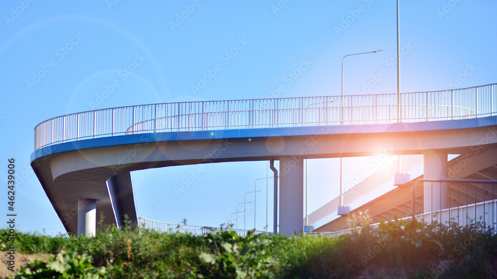 Bicycle path and sidewalk through the highway bridge. Bicycle path and sidewalk through the highway bridge.