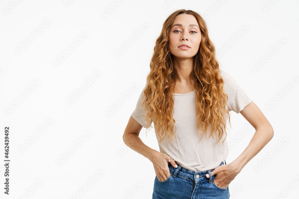 Young ginger woman wearing t-shirt posing and looking at camera Young ginger woman wearing t-shirt posing and looking at camera