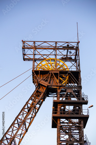 The elevator of the hoist shaft in the black coal mine. Coal mine hoist against the sky. Photo taken under natural lighting conditions