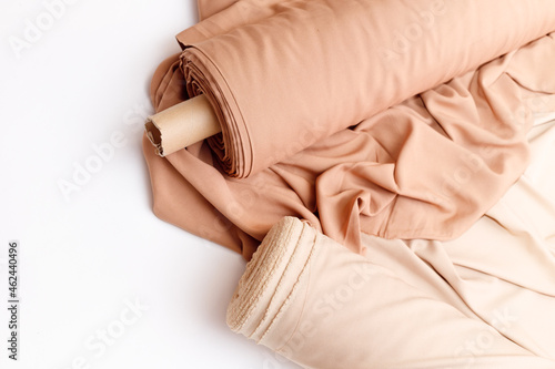 Obraz na płótnie Rolls of pastel color fabric isolated on white w salonie