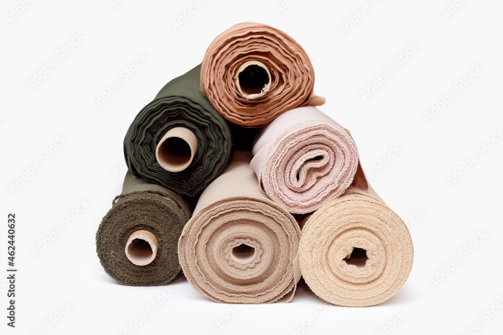 Stack of pastel color fabric rolls isolated on white, Synthetic and natural fabrics with copyspace