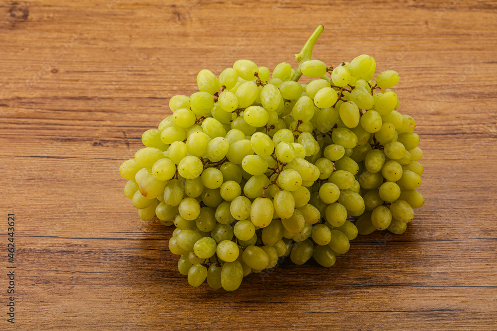 Green grape branch over background Green grape branch over background