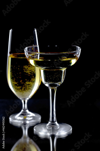 Glasses of wine on a black background.