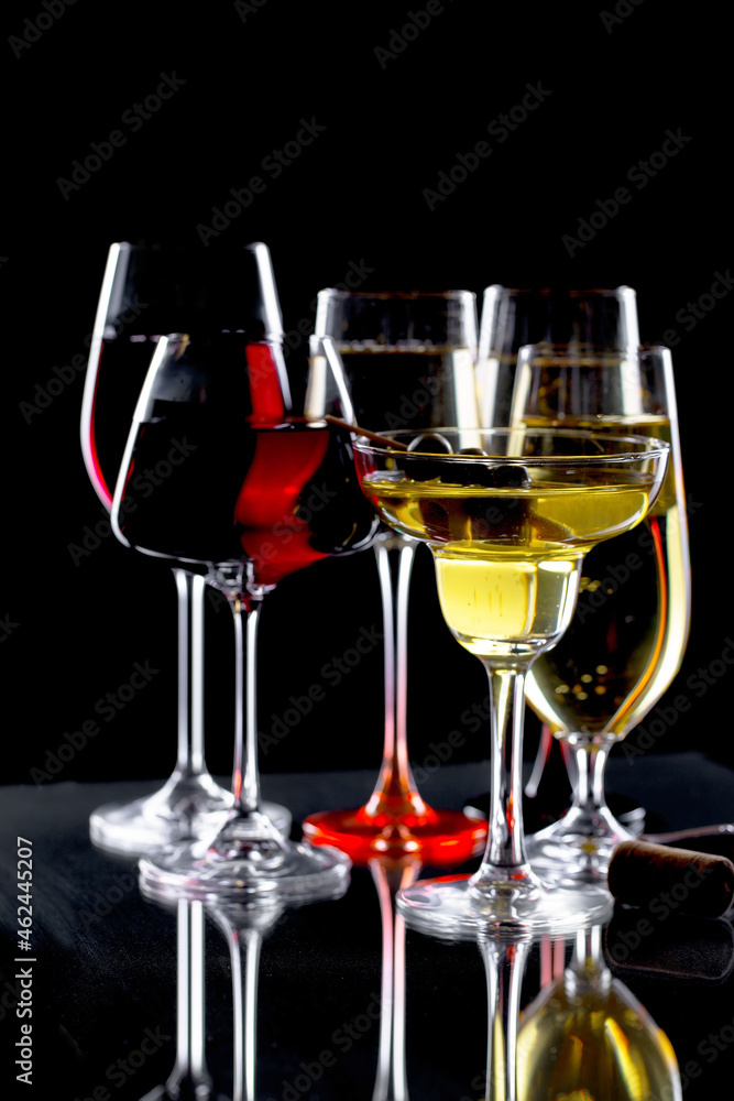 Glasses of wine on a black background. Glasses of wine on a black background.