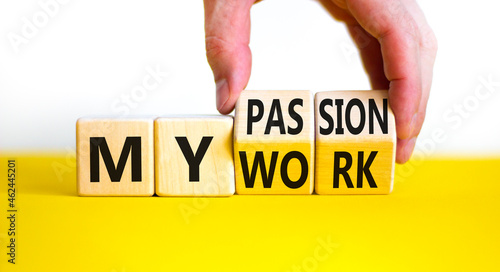 My work or passion symbol. Businessman turns wooden cubes and changes words 'My work' to 'My passion'. Beautiful white table, white background, copy space. Business and my work or passion concept.