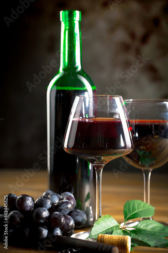 Wine in a glass on an old background