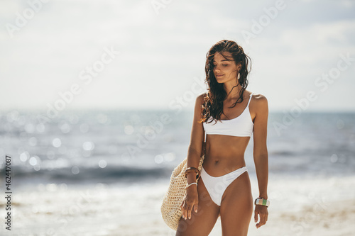 Print op canvas Tanned Woman in White Bikini on the Summer Beach