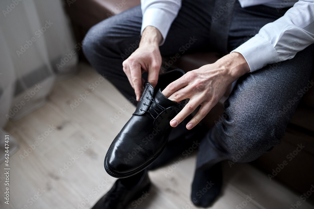 Fototapeta premium businessman clothes shoes, man getting ready for work,groom morning before wedding ceremony. Men Fashion
