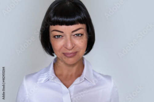 Portrait of a middle-aged woman in a business style. photo