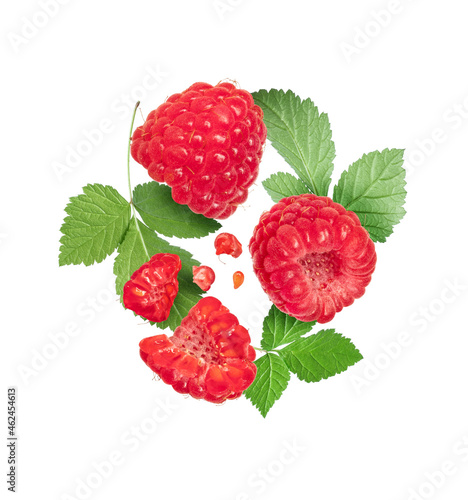 Ripe raspberries with leaves close up isolated on white background