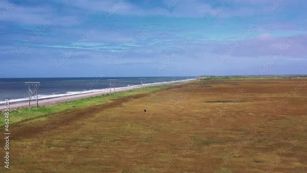 Kamchatka,Russia-Aug 27,2020:Slow motion aerial landscape of coast sea okhotsk, road, meadow and fields.4k,footage Kamchatka,Russia-Aug 27,2020:Slow motion aerial landscape of coast sea okhotsk, road, meadow and fields.4k,footage