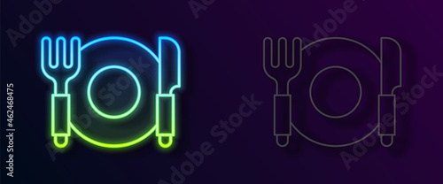 Glowing neon line Plate, fork and knife icon isolated on black background. Cutlery symbol. Restaurant sign. Vector