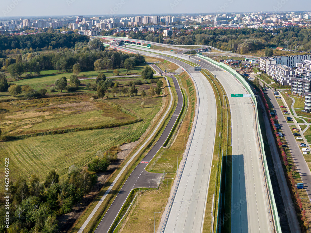 Highway or Freeway road. Wide road with many lanes. Highway for any transportation. Road for cars and trucks Warsaw Poland roads. Panorama landscape. Aerial view.  S2 Wilanow tunnel