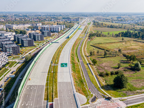 Highway or Freeway road. Wide road with many lanes. Highway for any transportation. Road for cars and trucks Warsaw Poland roads. Panorama landscape. Aerial view. S2 Wilanow tunnel