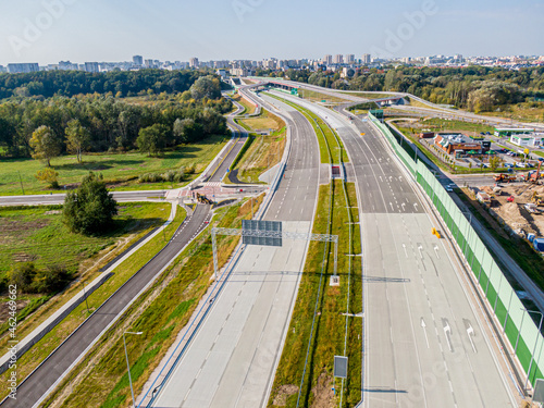 Highway or Freeway road. Wide road with many lanes. Highway for any transportation. Road for cars and trucks Warsaw Poland roads. Panorama landscape. Aerial view. S2 Wilanow tunnel