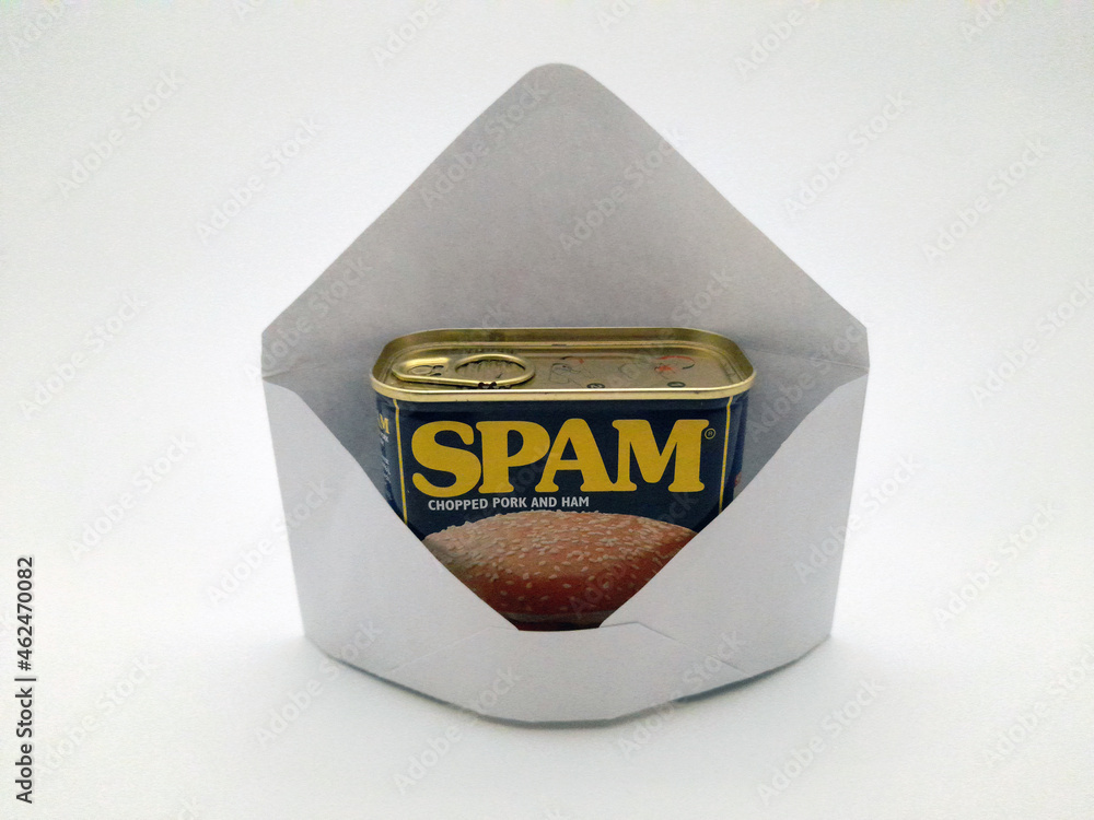 An envelope with spam in it, not digital spam but the canned ham type of spam symbolizing unwanted junk in your e-mail. - obrazy, fototapety, plakaty 