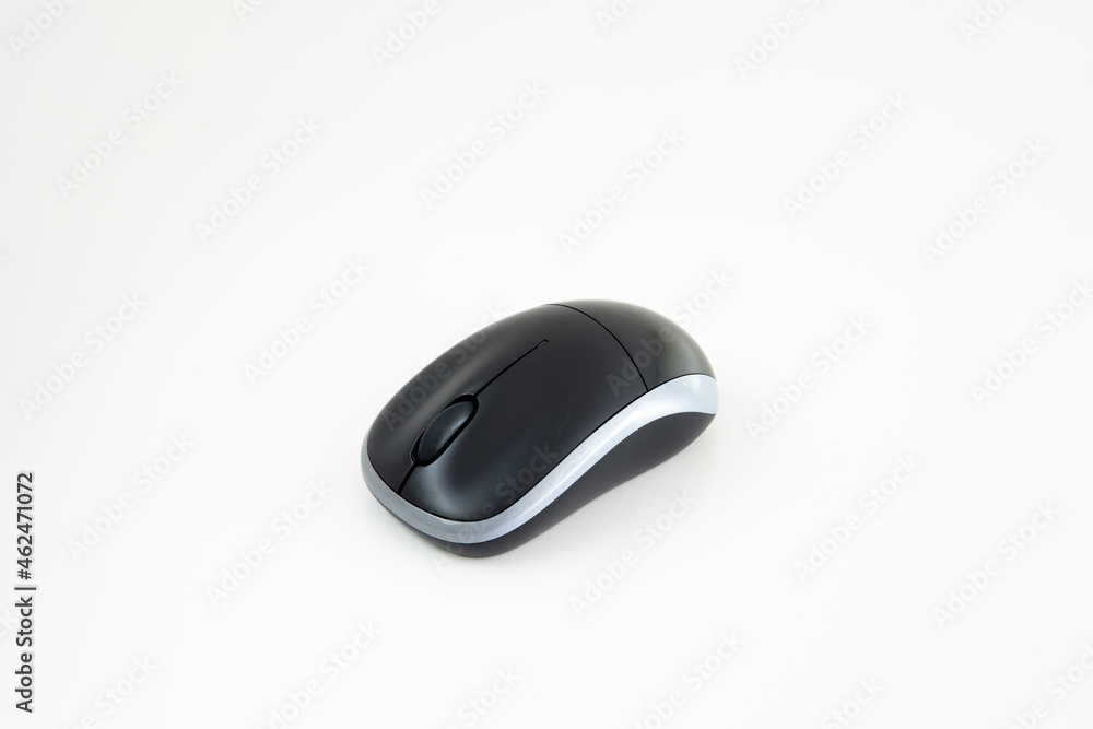 Small black wireless computer mouse isolated on white background. Close up studio shot, no people Small black wireless computer mouse isolated on white background. Close up studio shot, no people