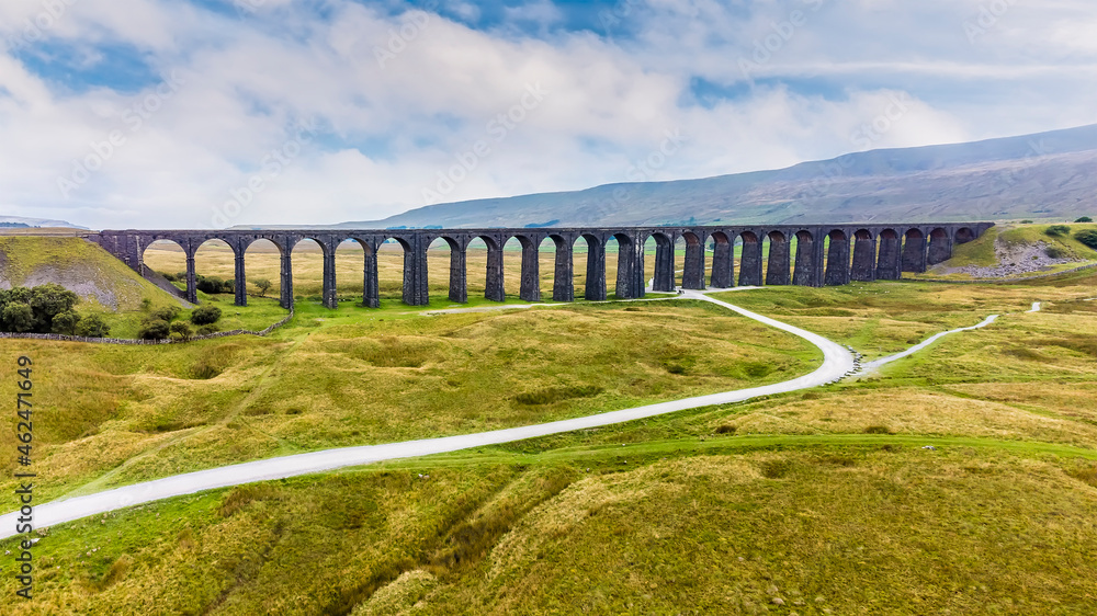 Fototapeta premium An aerial view towards the Ribblehead Viaduct, Yorkshire, UK on a summers day