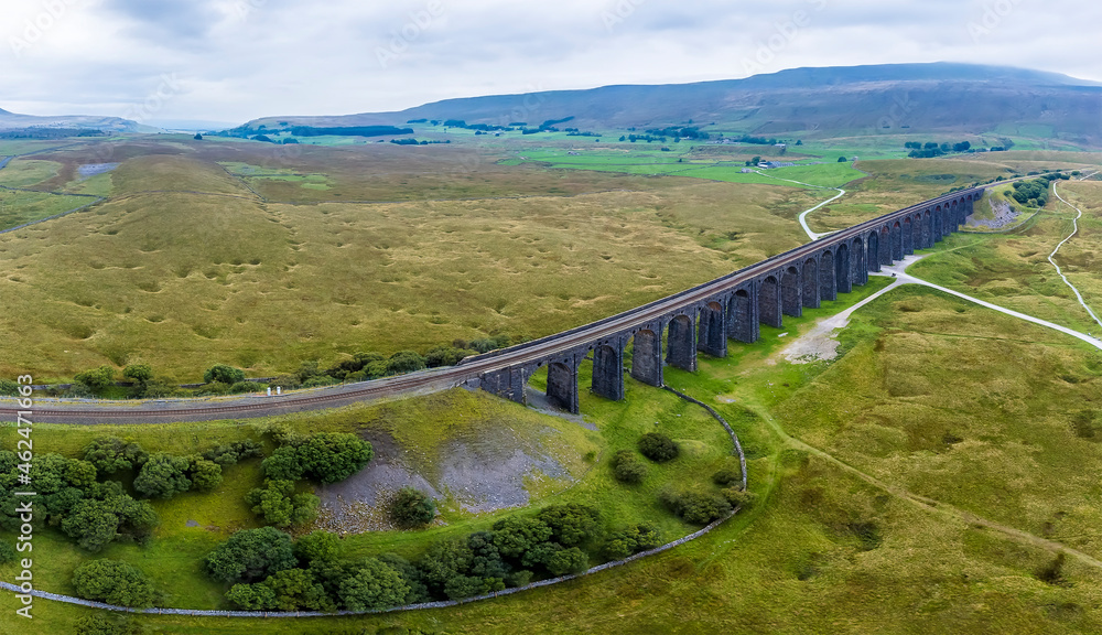 An aerial view over the Ribblehead Viaduct, Yorkshire, UK on a summers day