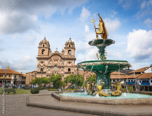 Inca Fountain and Iglesia de la Compania de Jesus Church at Plaza de Armas (Main Square) - Cusco, Peru photo