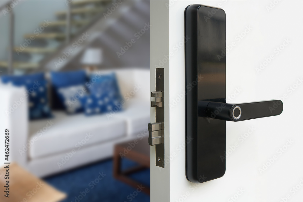 Digital Door handle or Electronics knob for access to room security, Door wooden half opening through interior living room background, Digital Door handle or Electronics knob for access to room security, Door wooden half opening through interior living room background,