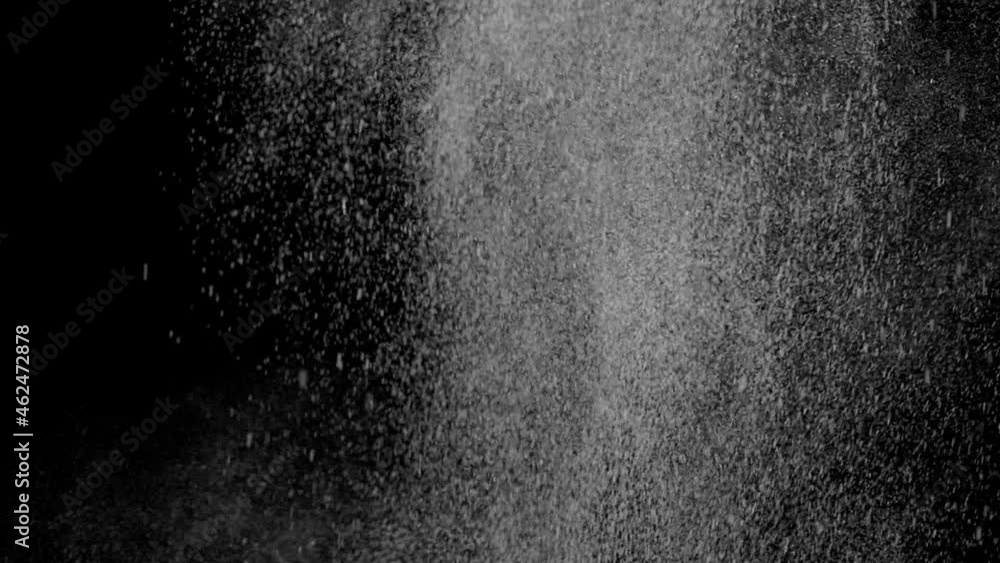 Refreshing cloud of liquid drops flies on black background Refreshing cloud of liquid drops flies on black background