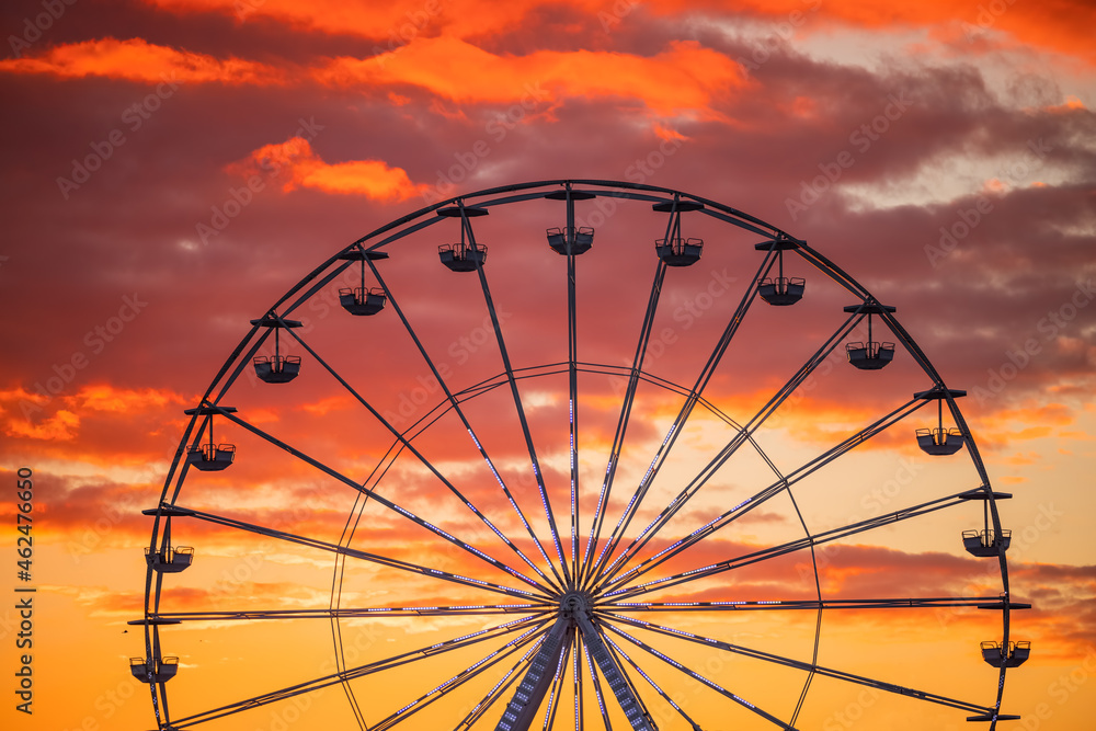 Ferris Wheel at sunset sky