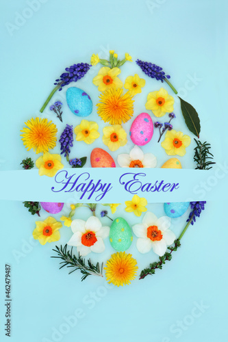 Happy Easter egg shape concept with flowers, leaves and eggs on pastel blue background. Easter abstract composition. Flat lay top view with text.