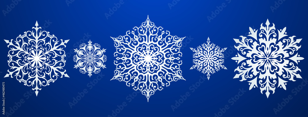Set of beautiful complex Christmas snowflakes, white on blue background