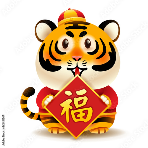Cute tiger with traditional Chinese costume hold Chinese greeting symbol. Isolated. Translation - Good fortune.