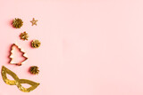 Creative Christmas pink background with golden collection of toys for decoration